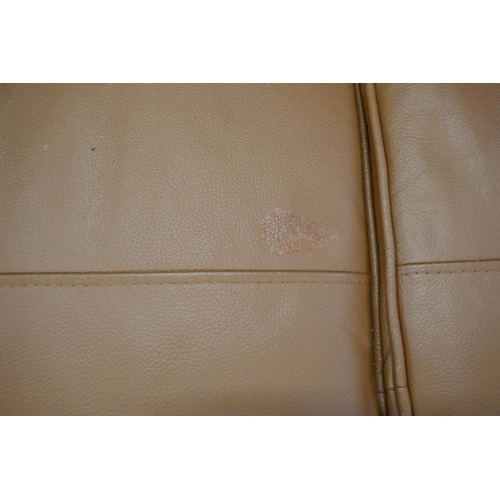 1591 - A tan leather Hoxton love seat (damaged)