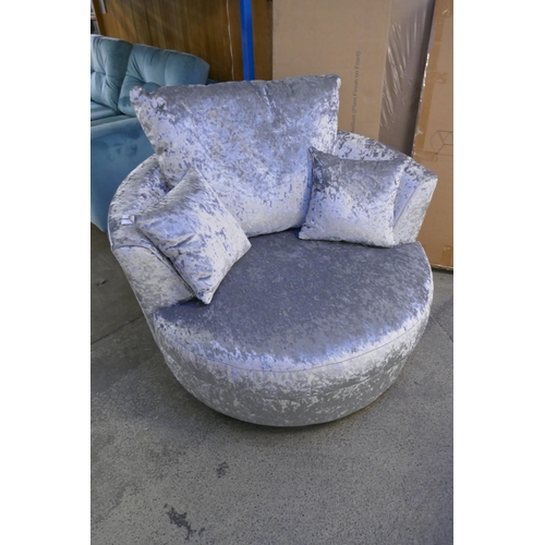 1595 - A silver velvet swivel armchair