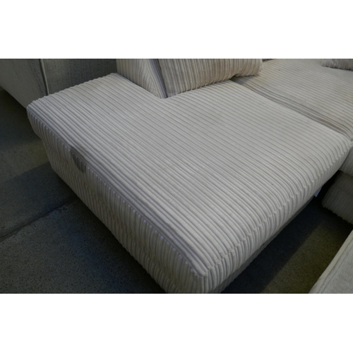 1596 - A white jumbo cord corner sofa and ottoman footstool (damaged)