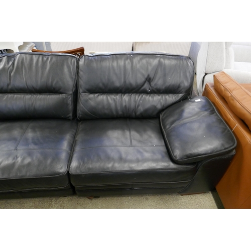 1600 - A black upholstered and leather large corner sofa