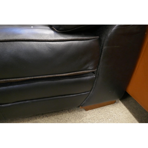 1600 - A black upholstered and leather large corner sofa