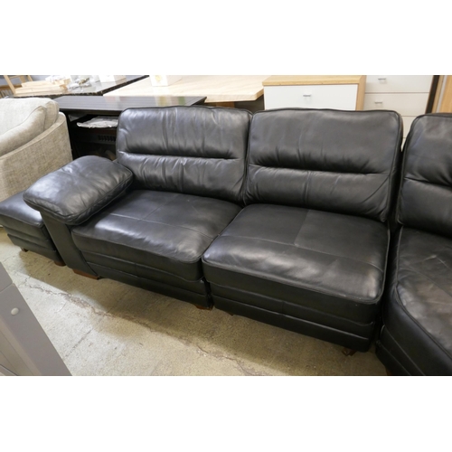 1600 - A black upholstered and leather large corner sofa