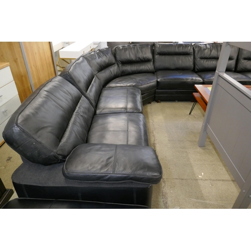 1600 - A black upholstered and leather large corner sofa