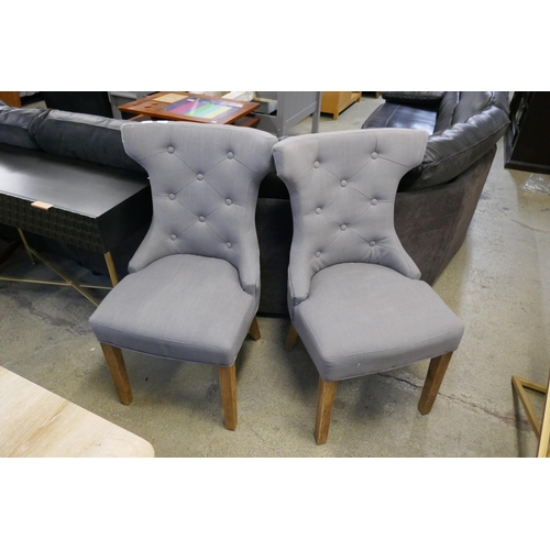 1620 - A pair of grey upholstered dining chairs