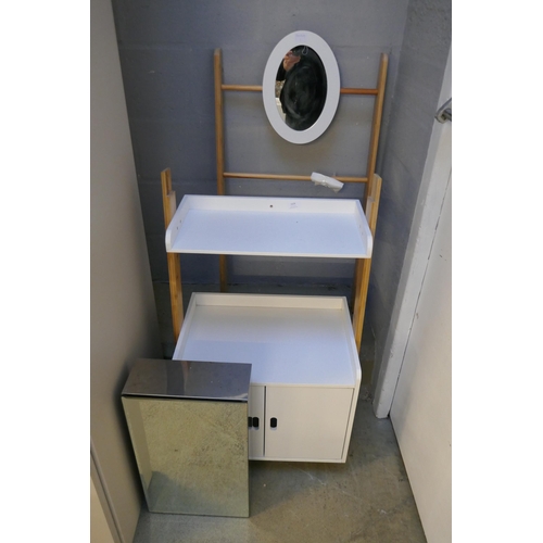 1628 - A leaning bathroom cabinet and silver mirrored bathroom cabinet