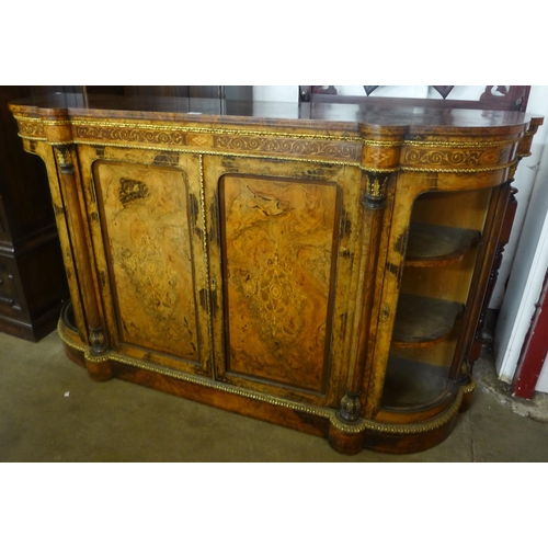 104 - A Victorian inlaid figured walnut and ormolu mounted credenza (lacking glass to doors)