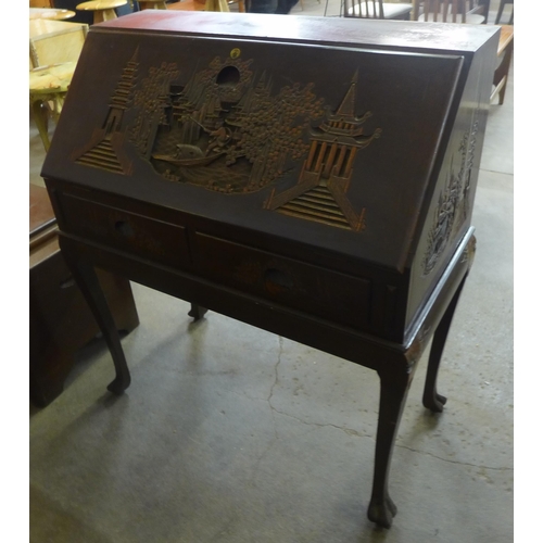 106 - A Chinese hardwood carved hardwood bureau de dame