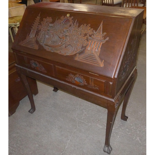 106 - A Chinese hardwood carved hardwood bureau de dame