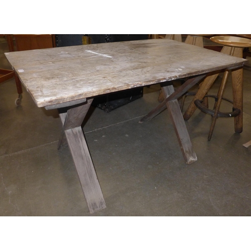 111 - A Victorian oak x-frame refectory table