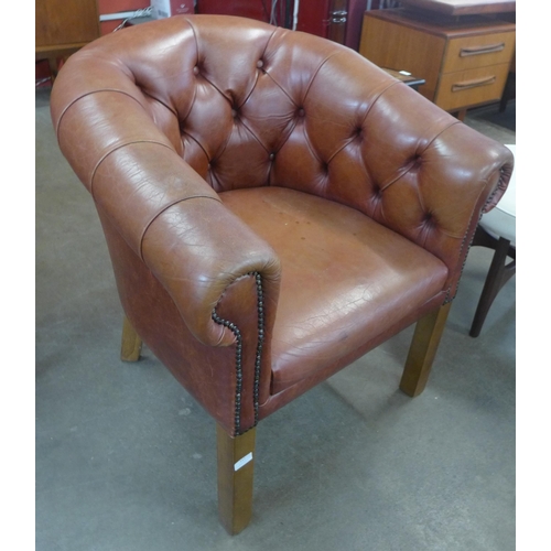 117 - A chestnut brown leather club chair