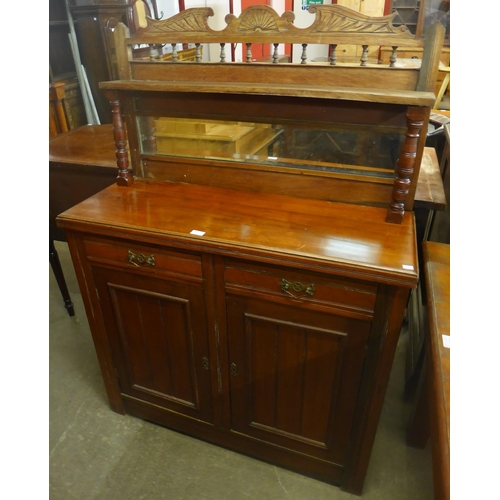 121 - A Victorian walnut mirrorback side cabinet