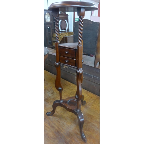 123 - A Victorian style mahogany wig stand