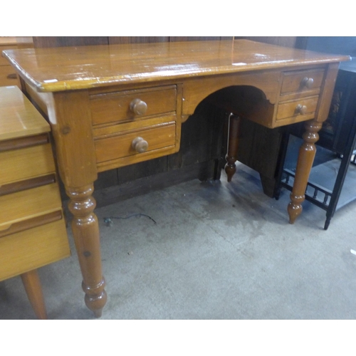 131 - A Victorian style stained pine writing table