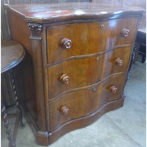 136 - A 19th Century French mahogany serpentine chest of drawers