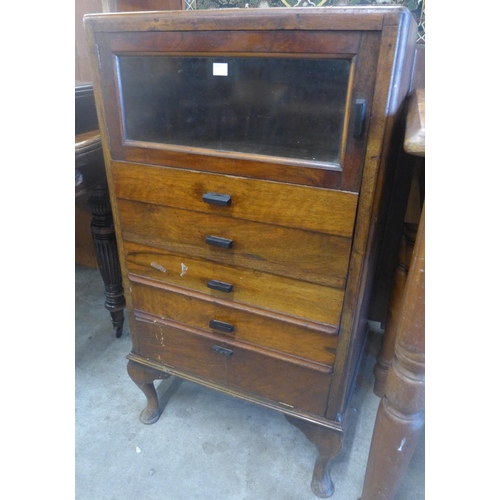 138 - An early 20th Century pine and beech music cabinet