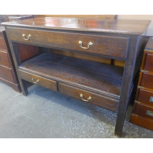 143 - A George III style oak three drawer two tier serving table