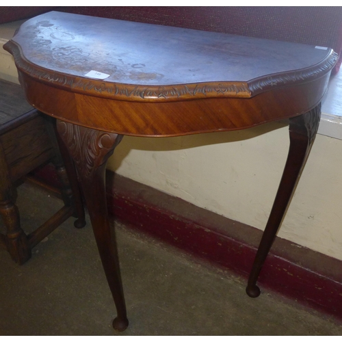 148 - A burr walnut demi-lune hall table