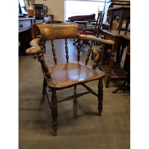 156 - A Victorian elm and beech smokers bow chair