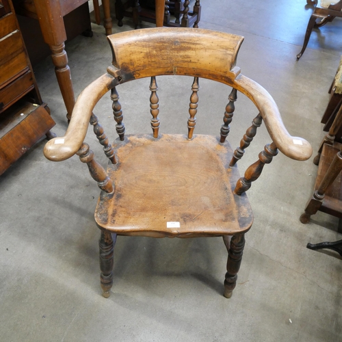 156 - A Victorian elm and beech smokers bow chair