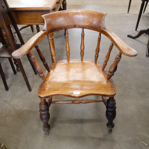 159 - A Victorian elm and beech smokers bow chair