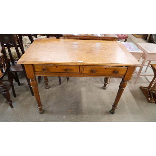 161 - A late Victorian two drawer writing table