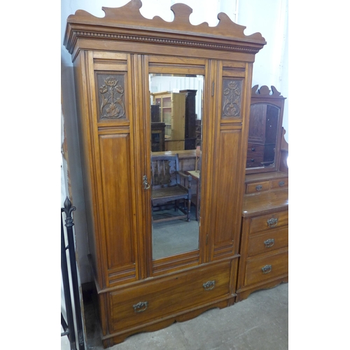 174 - A late Victorian carved walnut two piece bedroom suite