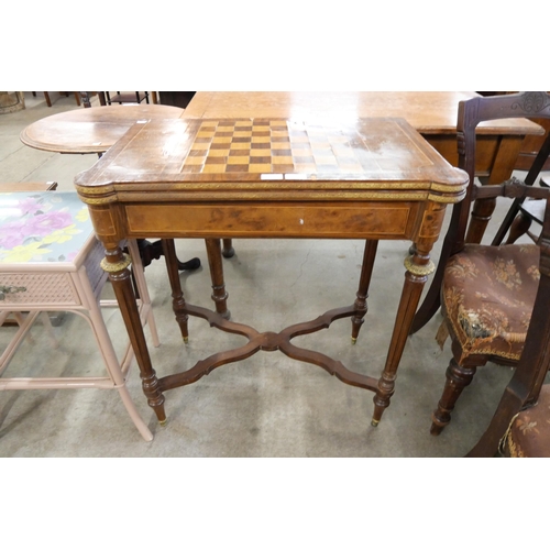 184 - A French 19th Century style walnut fold over games table