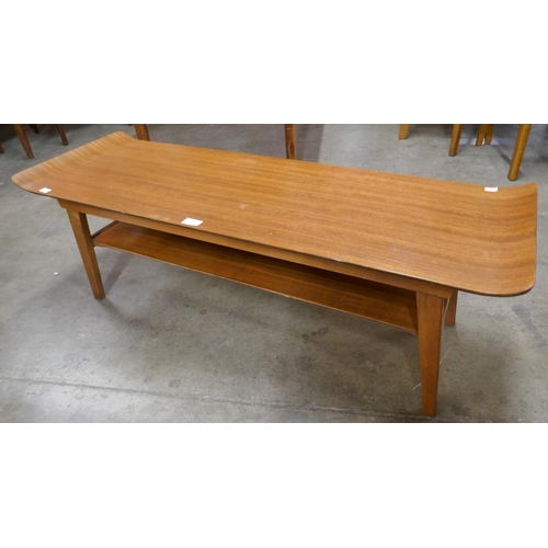 19 - A teak rectangular sleigh top coffee table