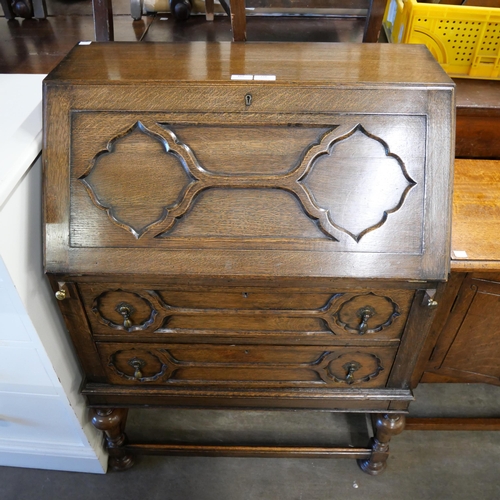 194 - An early 20th Century oak geometric moulded bureau