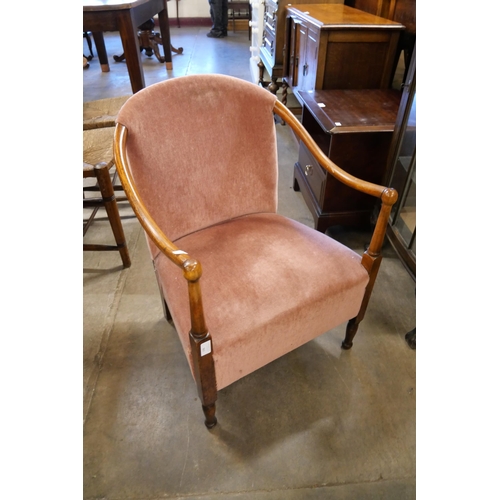 198 - A 1930's beech and fabric upholstered fireside chair