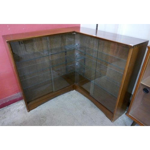 20 - A Herbert Gibbs teak corner display cabinet
