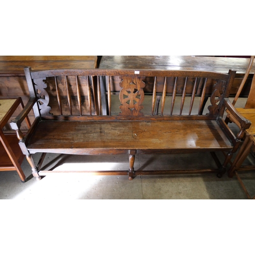 206 - An early 20th Century oak and elm bench