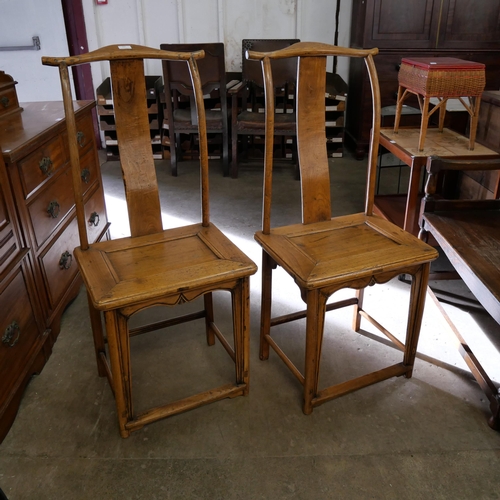 207 - A pair of 19th Century Chinese elm yoke back chairs