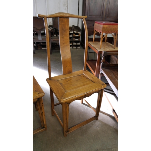 207 - A pair of 19th Century Chinese elm yoke back chairs