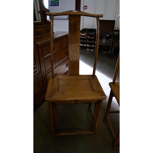 207 - A pair of 19th Century Chinese elm yoke back chairs