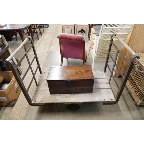 212 - An industrial steel flat bed trolley