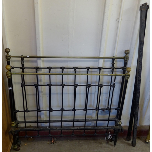 225 - A Victorian cast steel and brass bed