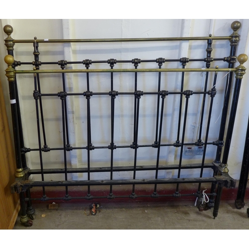 225 - A Victorian cast steel and brass bed