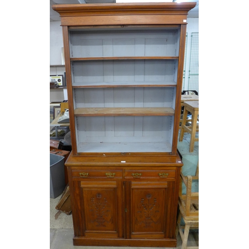 227 - A late Victorian carved walnut bookcase