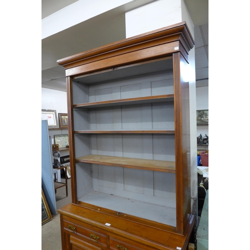 227 - A late Victorian carved walnut bookcase