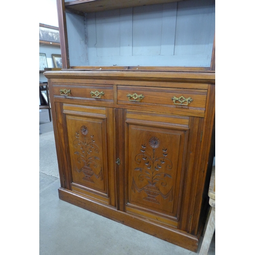 227 - A late Victorian carved walnut bookcase