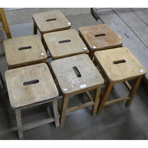 228 - Seven oak laboratory stools