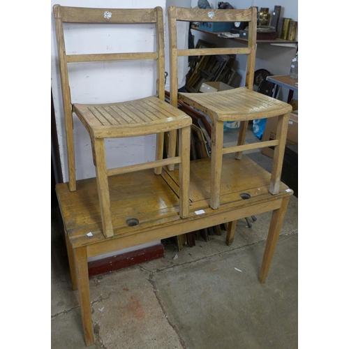 231 - A child's beech double school desk and two chairs