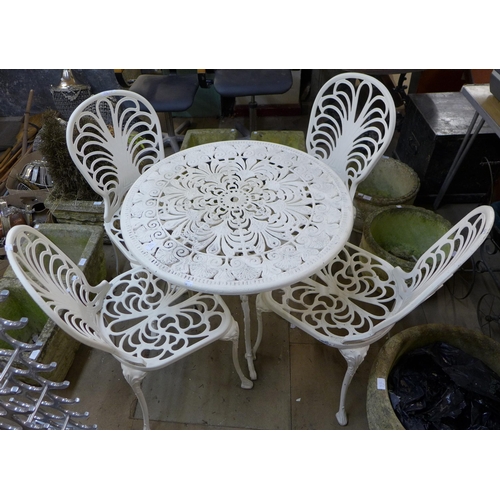 234 - A painted cast alloy garden table and four chairs