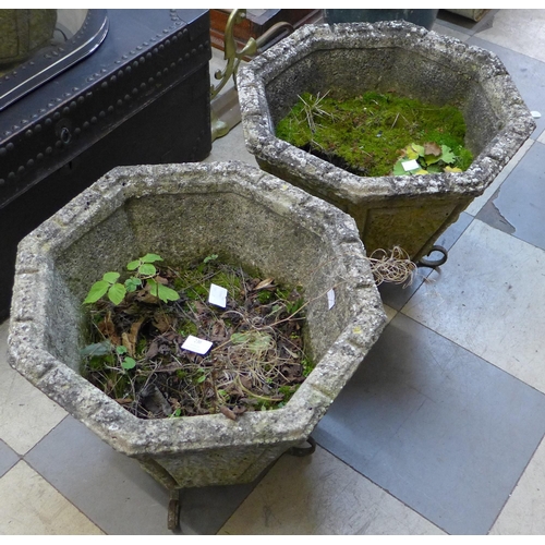 238 - A pair of concrete garden planters, on wrought steel stands