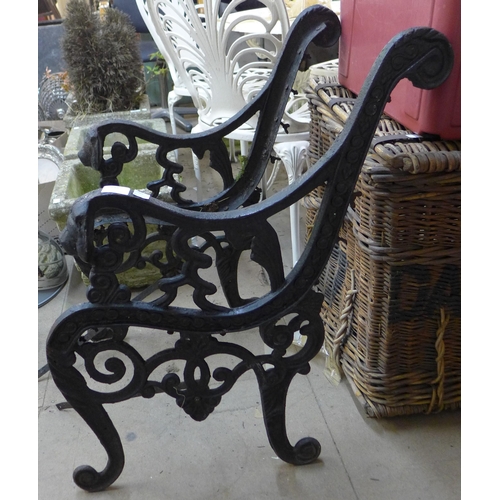 239 - A pair of cast iron bench ends