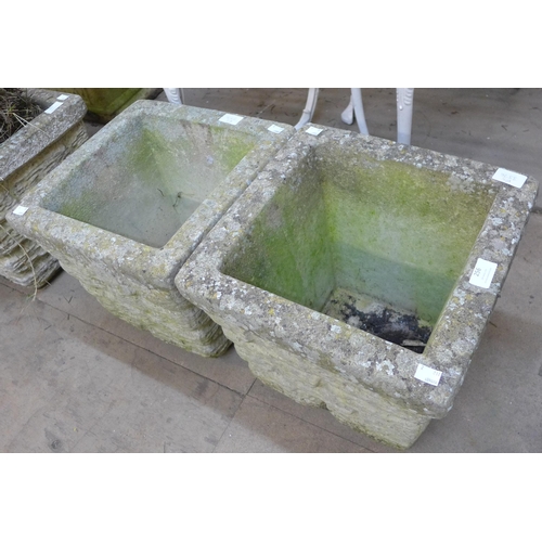 256 - A pair of square concrete garden planters