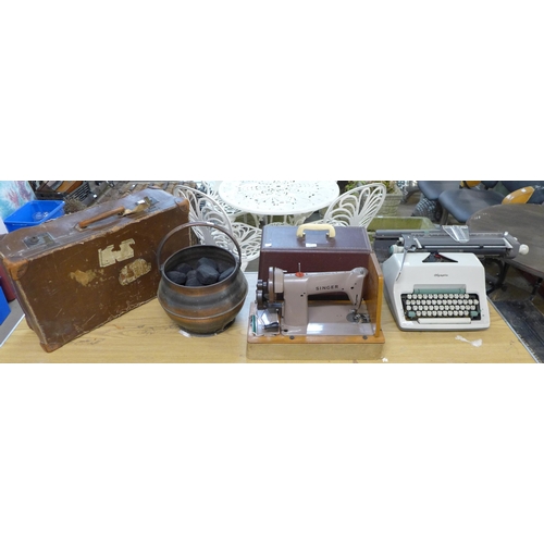 264 - A vintage Singer sewing machine, Olympia typewriter, leather case and a copper coal scuttle