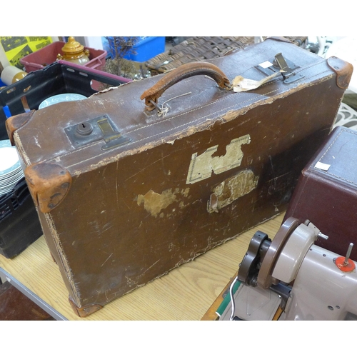 264 - A vintage Singer sewing machine, Olympia typewriter, leather case and a copper coal scuttle