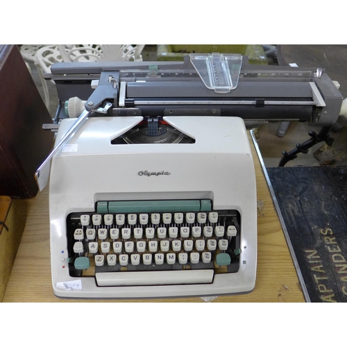 264 - A vintage Singer sewing machine, Olympia typewriter, leather case and a copper coal scuttle